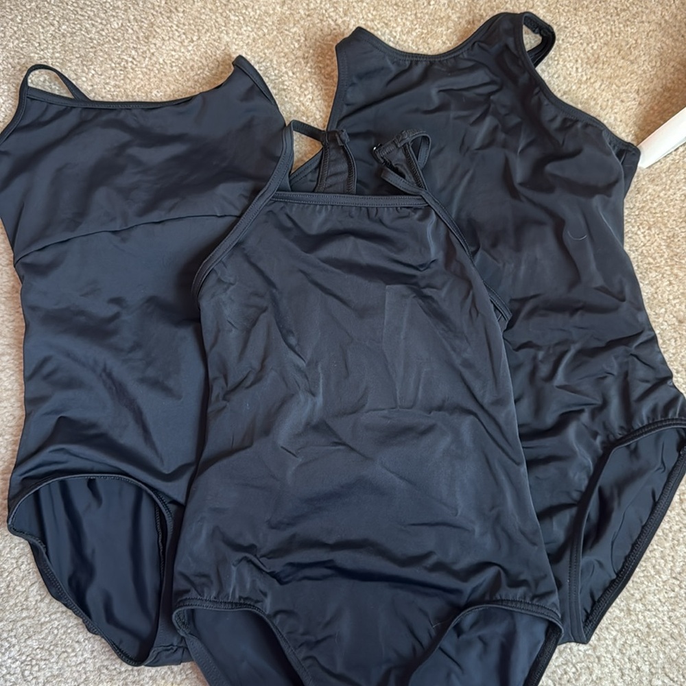 Set of three black leotards